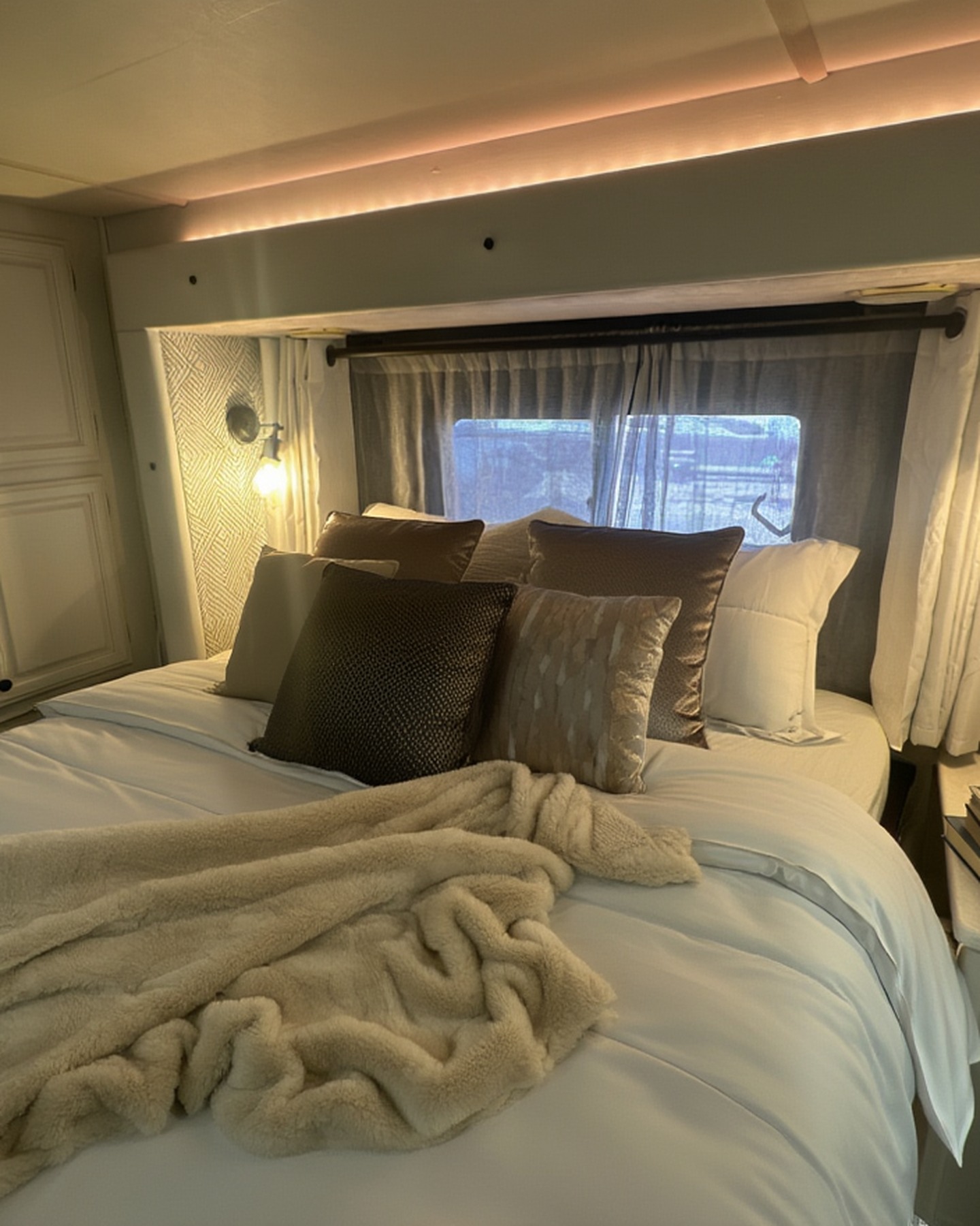 2004 Fleetwood Revolution 40C — master suite with LED valance lighting
