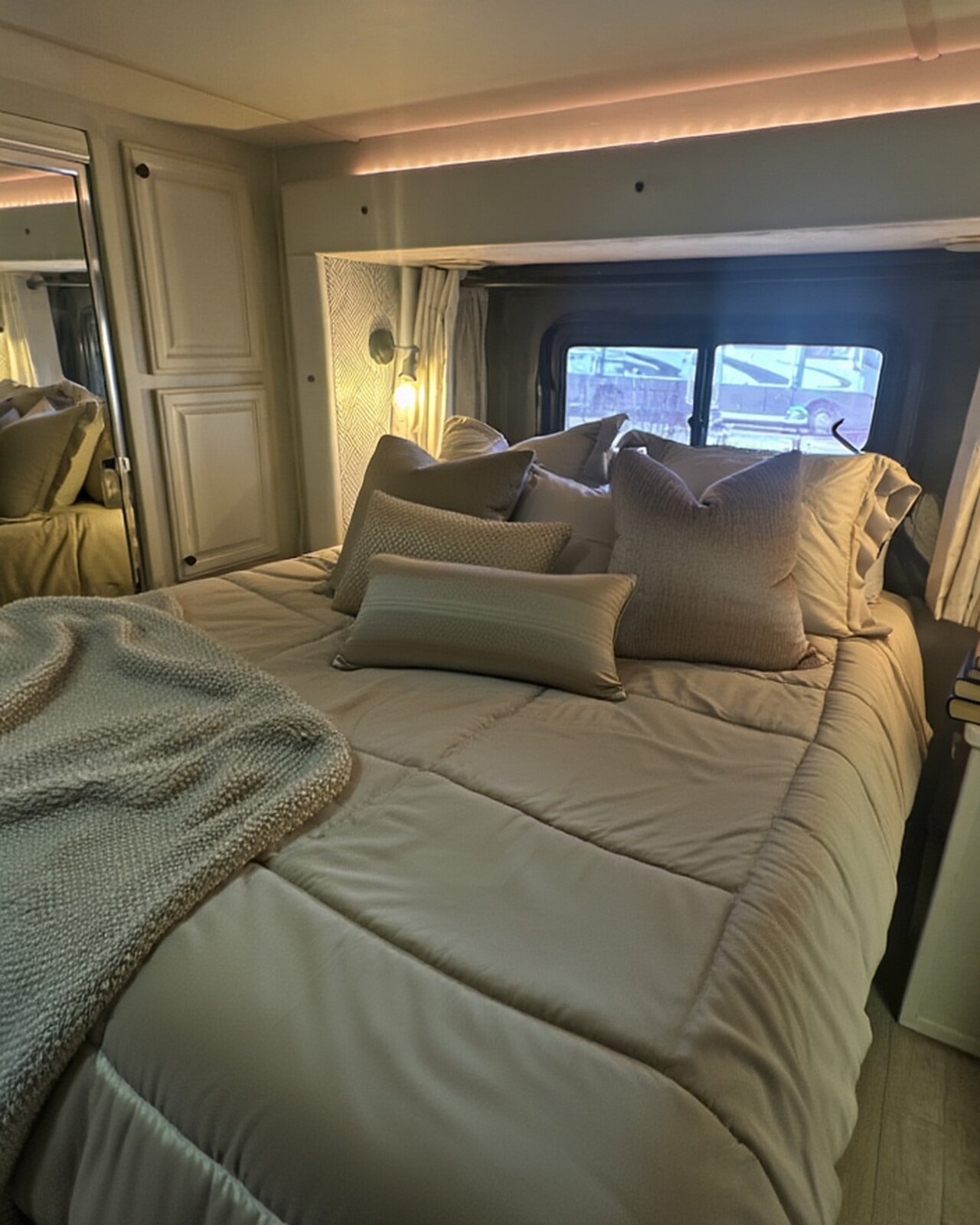 2004 Fleetwood Revolution 40C — Master suite — wide view with mirrored closet doors — Palm Desert CA