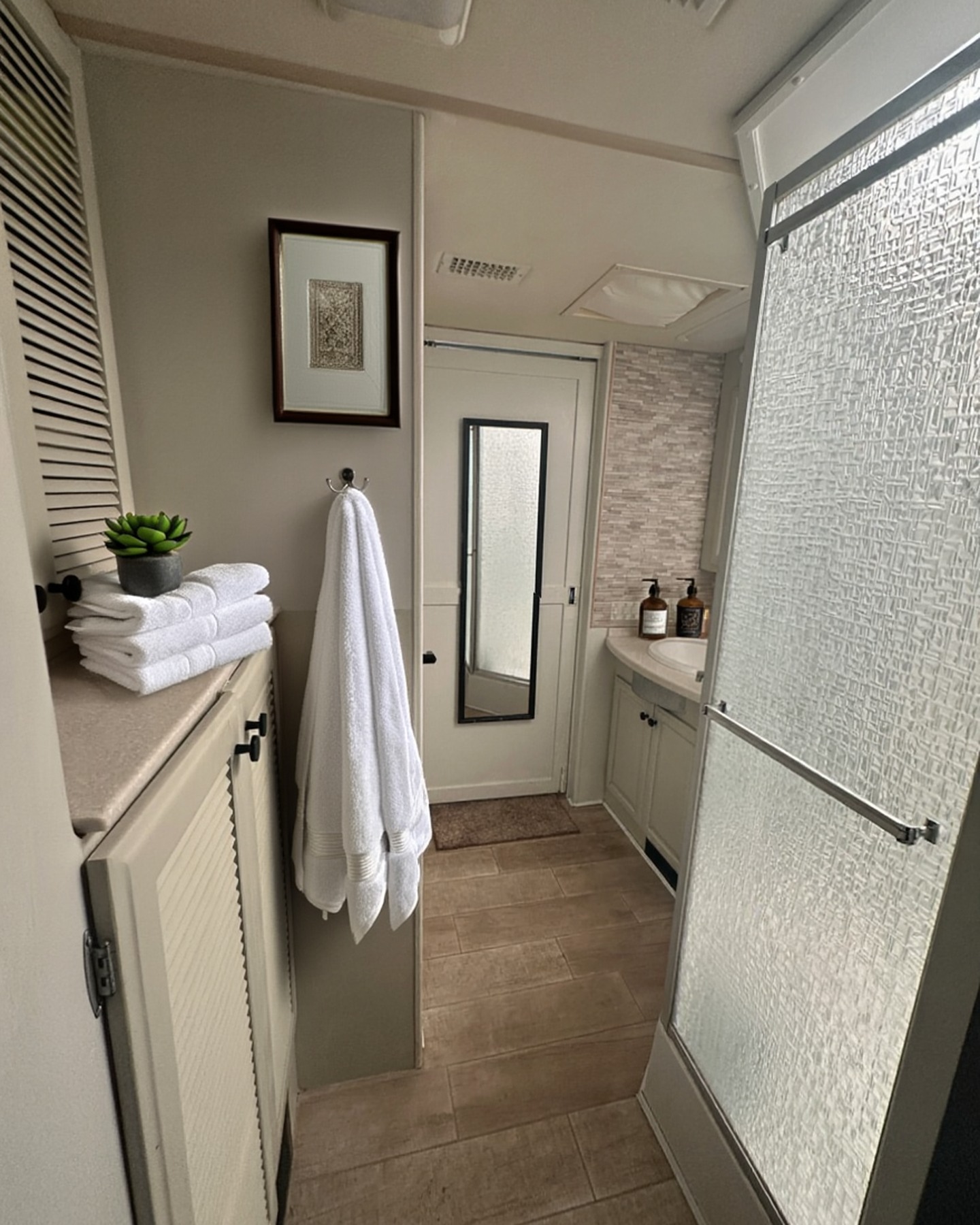 2004 Fleetwood Revolution 40C — Bathroom hallway, wide view — Palm Desert CA