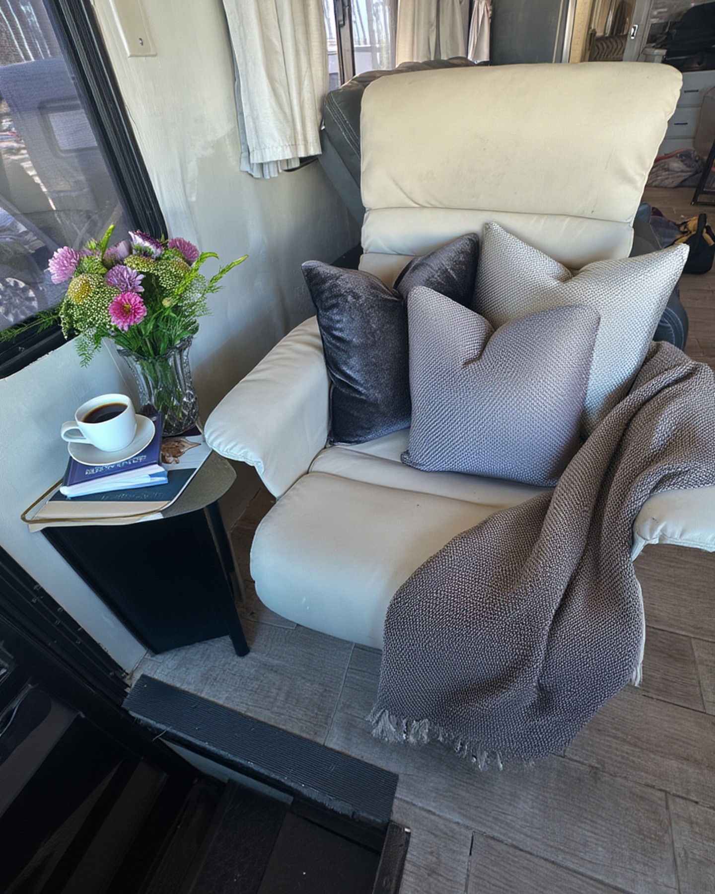 2004 Fleetwood Revolution 40C — Passenger chair staged with flowers and coffee — Palm Desert CA